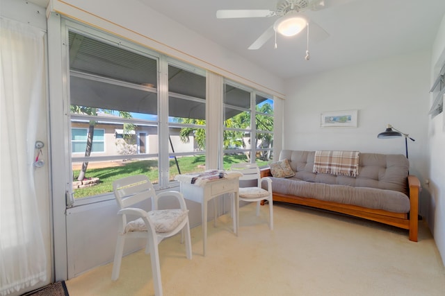 interior space with ceiling fan