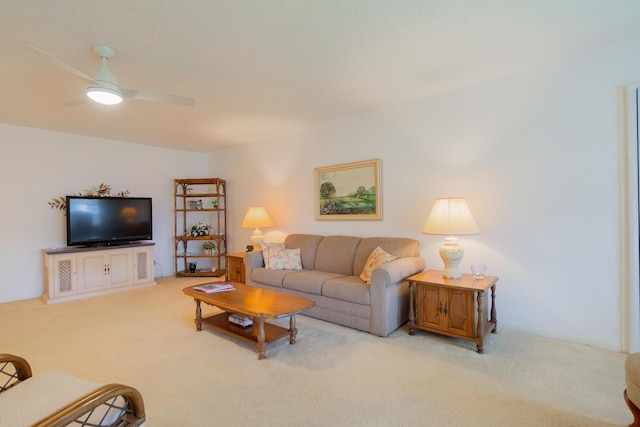 living room with ceiling fan and light carpet