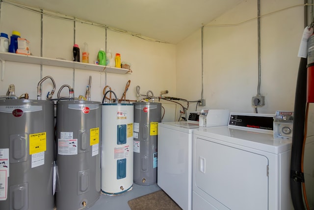 laundry area with washing machine and dryer and water heater