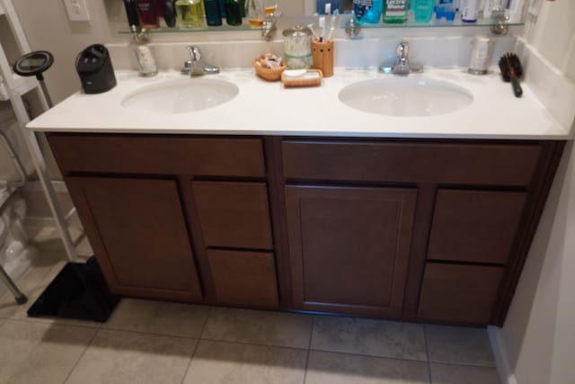 bathroom featuring tile patterned floors and vanity