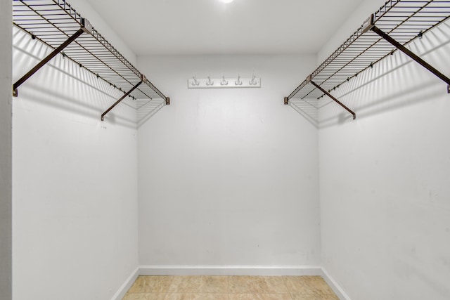 spacious closet featuring tile patterned floors