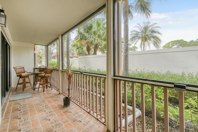 sunroom / solarium featuring a wealth of natural light