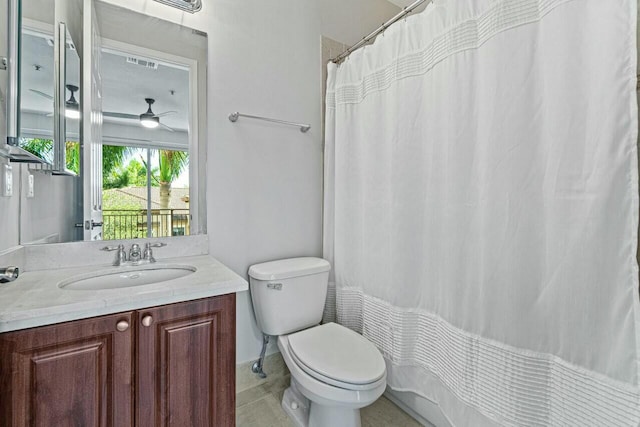 3016 Waterside Cir, Boynton Beach, FL 33435 - bathroom with toilet, vanity, ceiling fan, and a shower with shower curtain