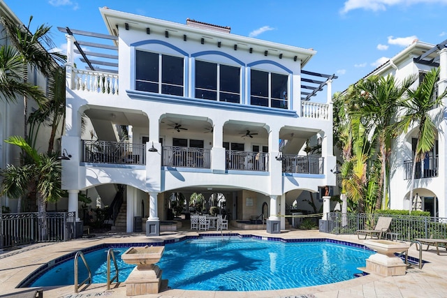 3016 Waterside Cir, Boynton Beach, FL 33435 - rear view of house featuring a balcony, a ceiling fan, a patio, fence, and stucco siding