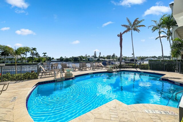 3016 Waterside Cir, Boynton Beach, FL 33435 - rear view of property with a balcony, a ceiling fan, a patio, and fence