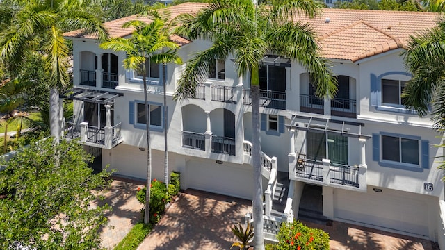 3016 Waterside Cir, Boynton Beach, FL 33435 - view of building exterior featuring a garage, decorative driveway, and stairs