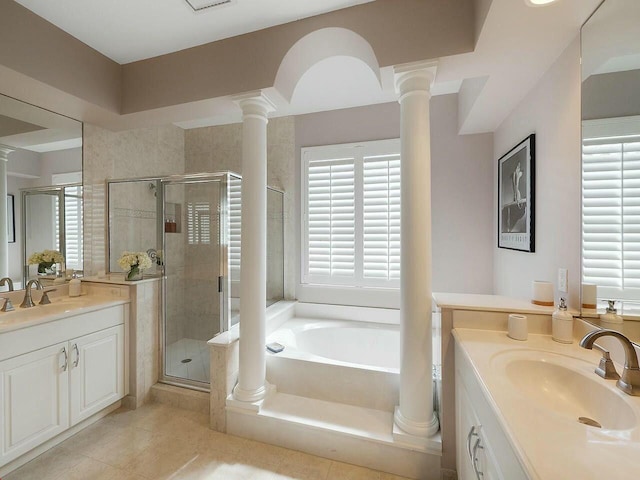 bathroom featuring two vanities, a sink, and ornate columns