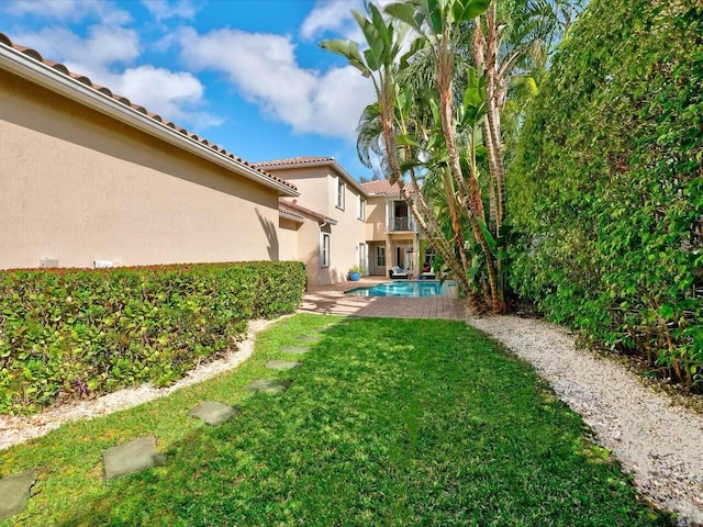 view of yard with a patio and an outdoor pool