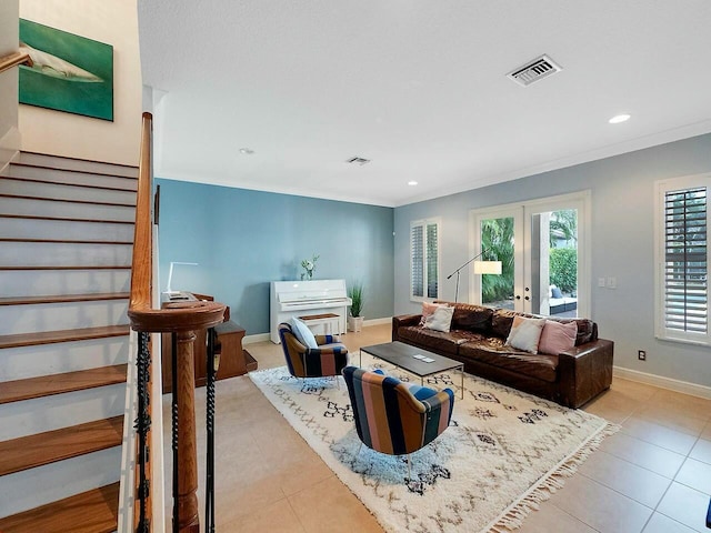 living room featuring french doors and ornamental molding