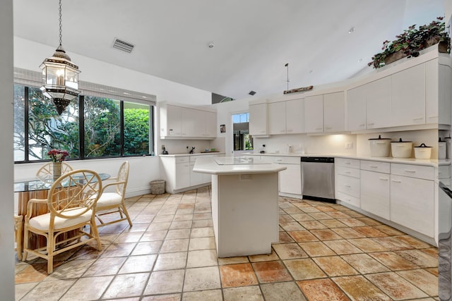 kitchen featuring pendant lighting, dishwasher, a center island, white cabinetry, and light tile patterned floors