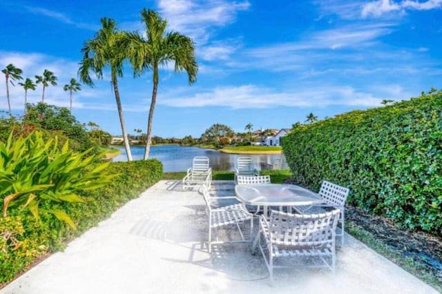 view of patio with a water view