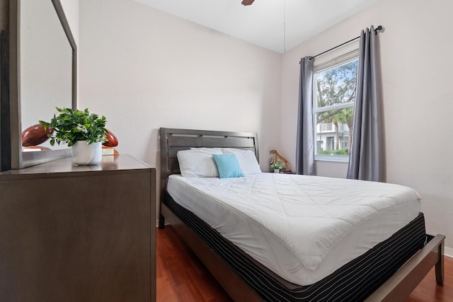 bedroom featuring ceiling fan and dark hardwood / wood-style floors