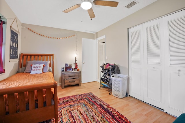 bedroom featuring hardwood / wood-style flooring, a closet, and ceiling fan