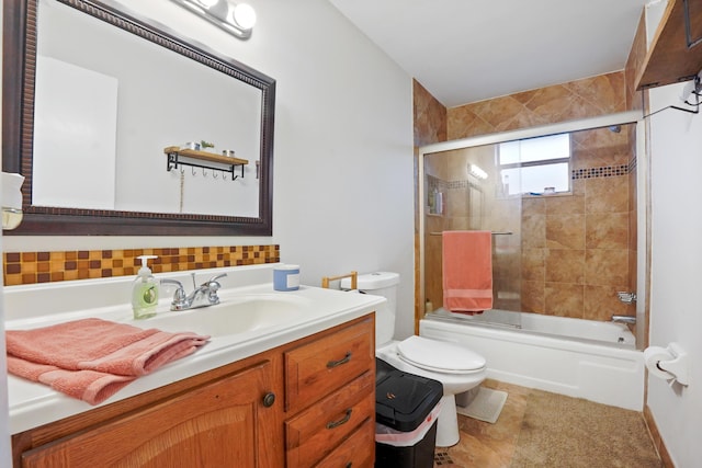 full bathroom featuring vanity, toilet, tile patterned floors, and bath / shower combo with glass door