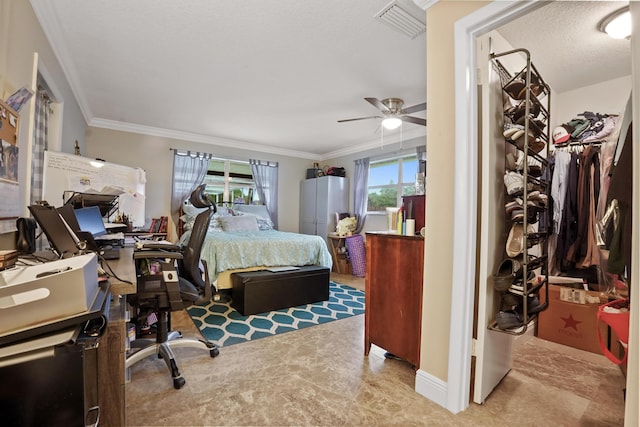 bedroom with ornamental molding, a walk in closet, ceiling fan, a textured ceiling, and a closet