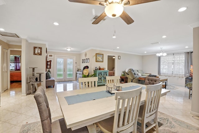 tiled dining space featuring french doors, crown molding, and ceiling fan with notable chandelier