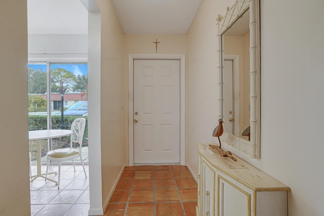 entryway with light tile patterned floors