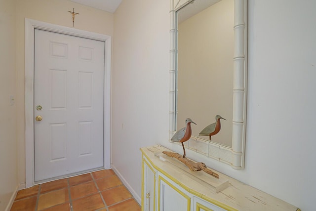 doorway with tile patterned flooring