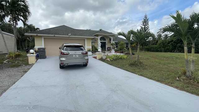 ranch-style house featuring a garage and a front yard