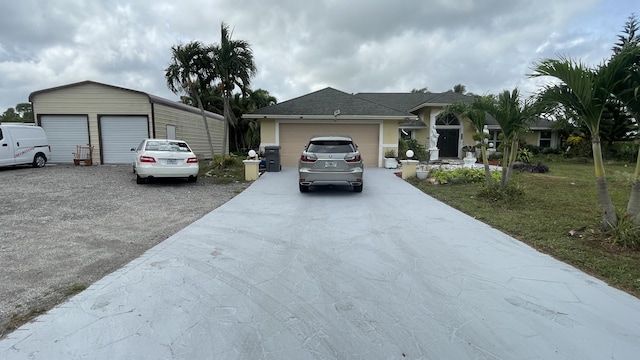 view of front of property with a front yard and a garage