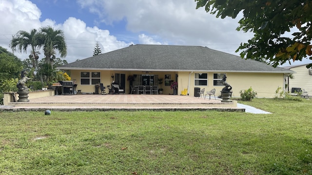 back of property featuring a patio area and a yard