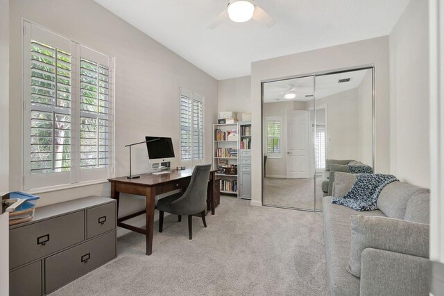 office featuring ceiling fan and light colored carpet