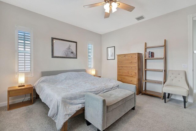 carpeted bedroom featuring ceiling fan