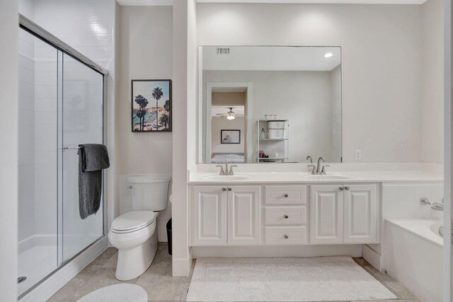 full bathroom with vanity, shower with separate bathtub, tile patterned floors, and toilet