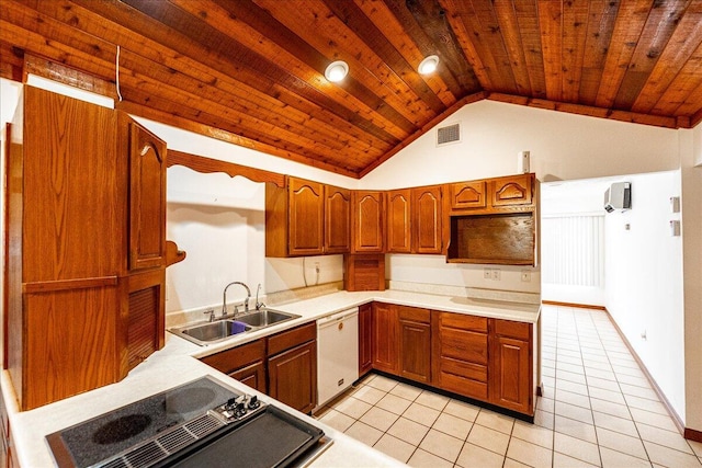 kitchen featuring white dishwasher, light tile patterned flooring, vaulted ceiling, and sink