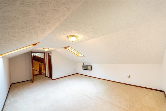 bonus room with a textured ceiling, lofted ceiling, and carpet