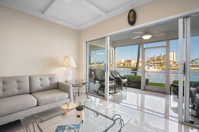 tiled living room featuring coffered ceiling, ceiling fan, and a water view