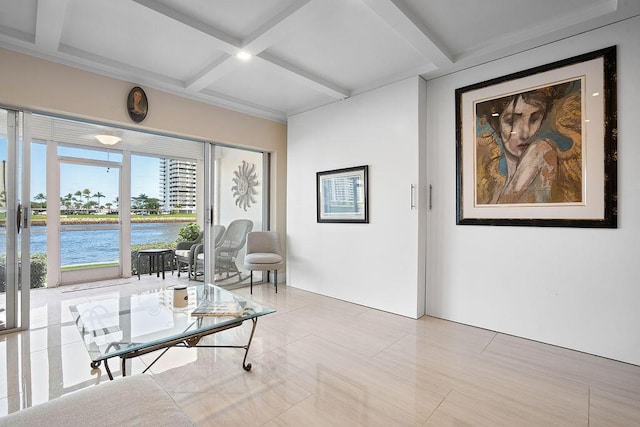 sitting room featuring coffered ceiling, light tile patterned floors, beamed ceiling, and a water view