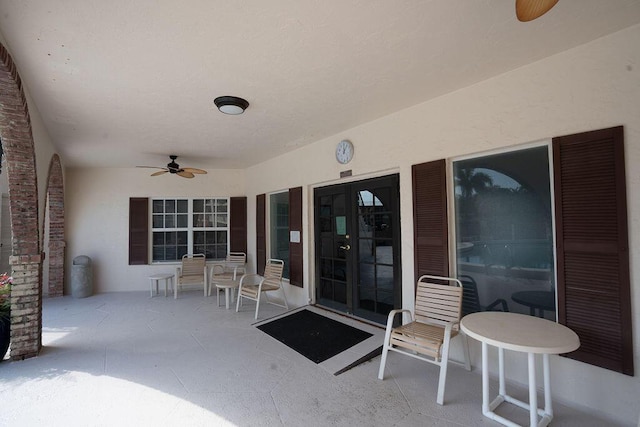 view of patio featuring ceiling fan