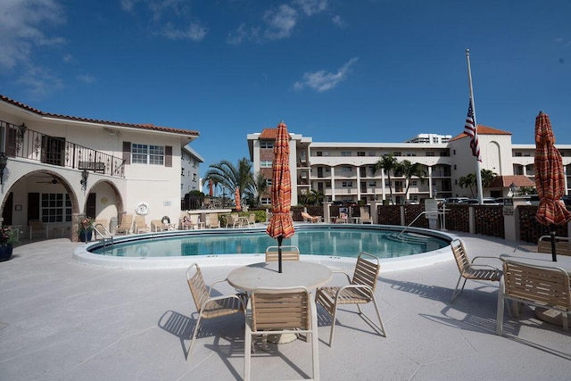 view of swimming pool with a patio area