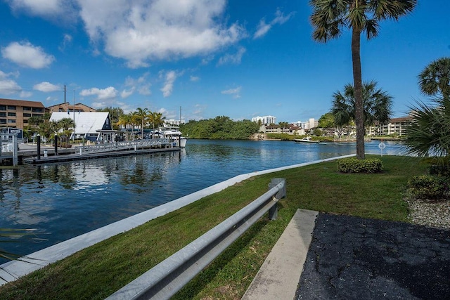 dock area featuring a yard and a water view