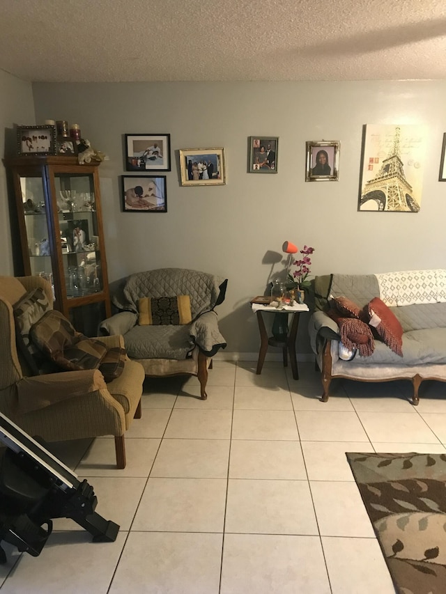 tiled living room with a textured ceiling