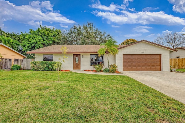 single story home with a garage and a front lawn