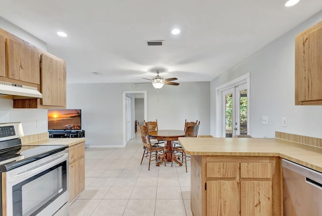 kitchen featuring appliances with stainless steel finishes, light brown cabinets, french doors, kitchen peninsula, and ceiling fan