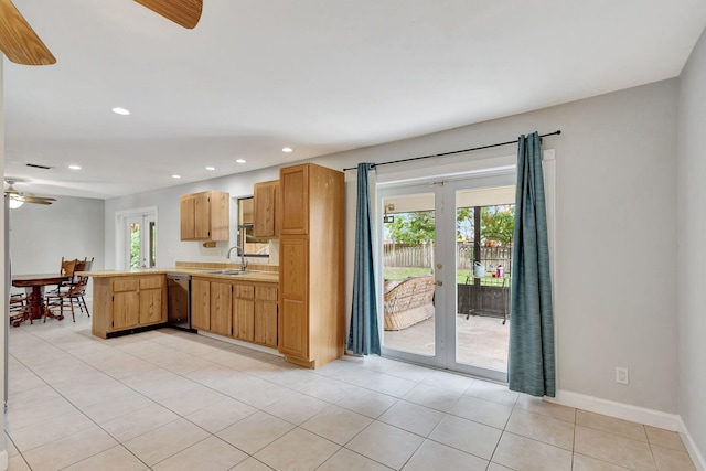 kitchen with light tile patterned floors, kitchen peninsula, ceiling fan, dishwasher, and french doors