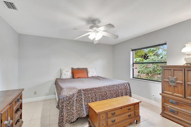 bedroom with ceiling fan and light tile patterned floors