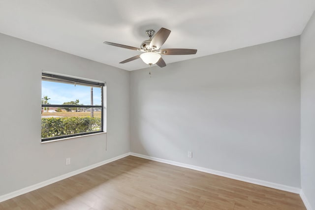 spare room with light hardwood / wood-style floors and ceiling fan