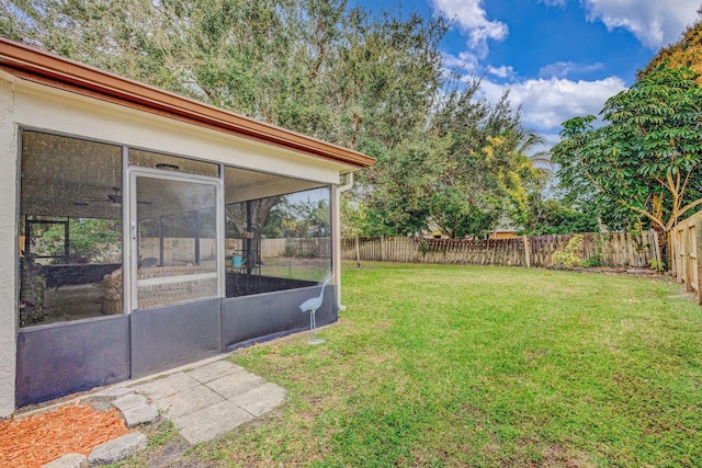 view of yard with a sunroom