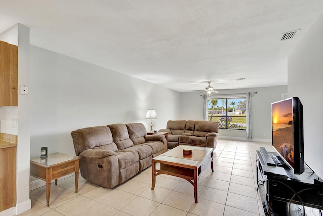 living room featuring ceiling fan and light tile patterned floors