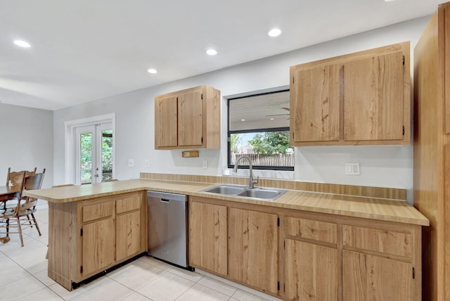 kitchen featuring stainless steel dishwasher, light brown cabinets, sink, kitchen peninsula, and light tile patterned floors