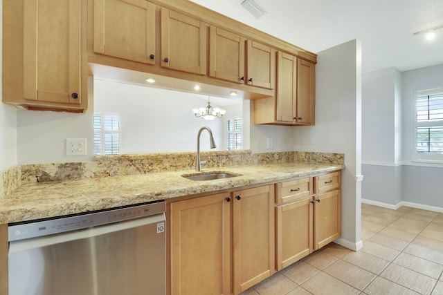 kitchen with light stone countertops, a notable chandelier, sink, stainless steel dishwasher, and light tile patterned flooring