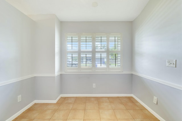 spare room with light tile patterned floors