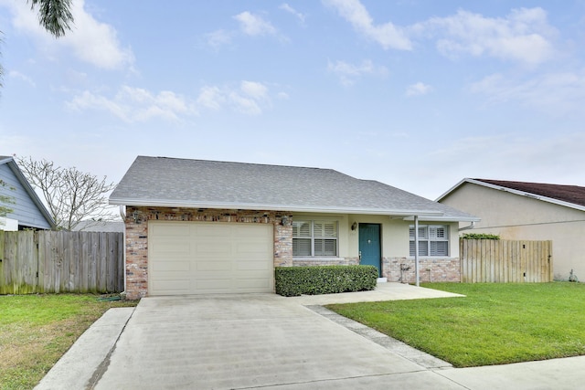 view of front of home with a front yard and a garage