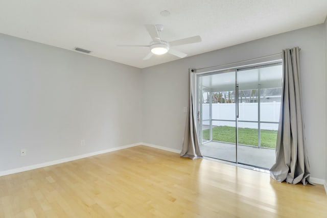 spare room featuring a textured ceiling, ceiling fan, and light hardwood / wood-style floors