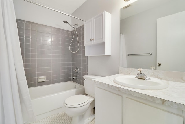 full bathroom with shower / tub combo, vanity, tile patterned floors, and toilet