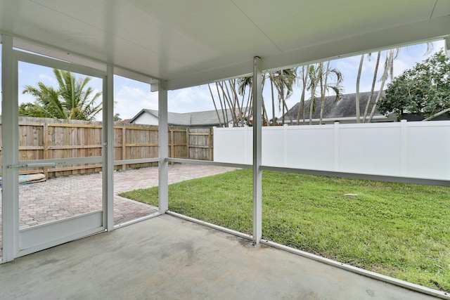 unfurnished sunroom featuring a wealth of natural light